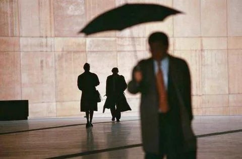 Umbrella, Standing, Fashion accessory, Shadow, Suit, Businessperson, White-collar worker, Gesture, 
