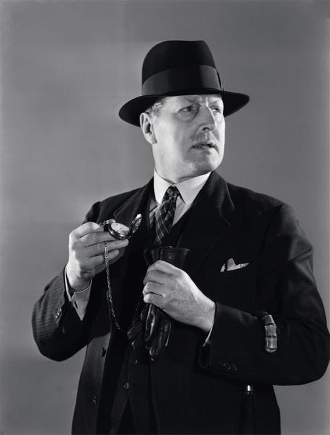 Man holding a watch c 1950.