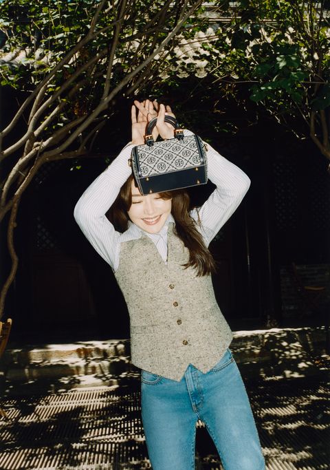 Tory Burch - Actress Nazha carrying the #TMonogram barrel bag  #ToryBurchFW21 Discover more