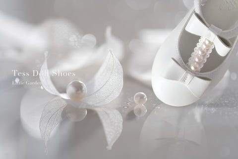 White, Footwear, Flower, Pearl, Shoe, Headpiece, Fashion accessory, Plant, Petal, Still life photography, 