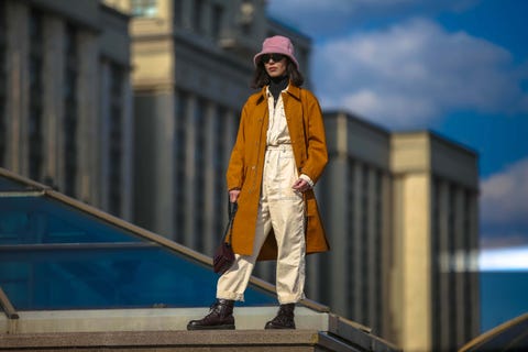 Yellow, Fashion, Street fashion, Outerwear, Urban area, Headgear, Architecture, Statue, City, Travel, Yellow, Fashion, Street fashion, Outerwear, Urban area, Headgear, Architecture, Statue, City, Travel,