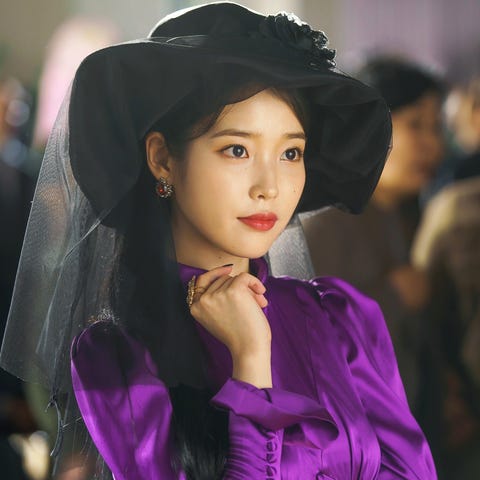 Face, Beauty, Fashion, Purple, Skin, Black hair, Headgear, Fashion design, Model, Formal wear,