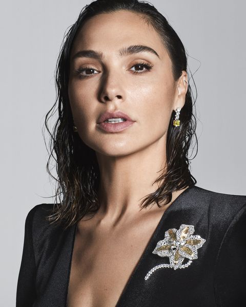Gal Gadot wearing a botanica orchid brooch and diamond earrings from Tiffany's 2022 blue book high jewelry collection