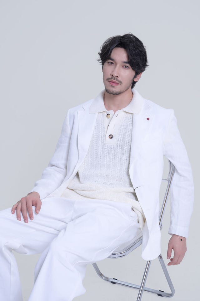 seated individual wearing white attire