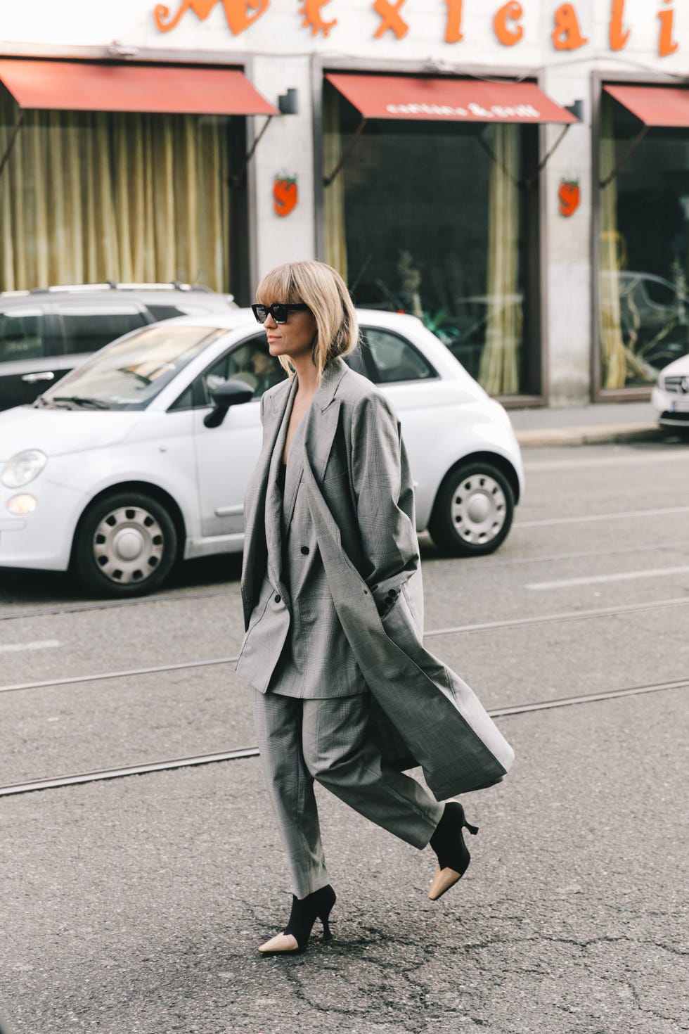 Street fashion, Photograph, Snapshot, Fashion, Footwear, Outerwear, Car, Street, Vehicle, Coat, 