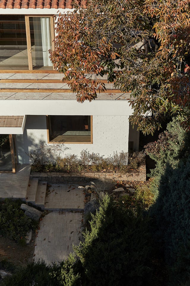 a house with a tree in the front