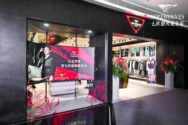 display for a fashion retail store featuring promotional signage and clothing