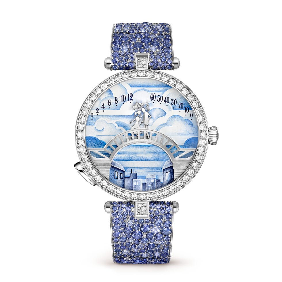 luxury watch with a decorative bluethemed dial and jeweled strap