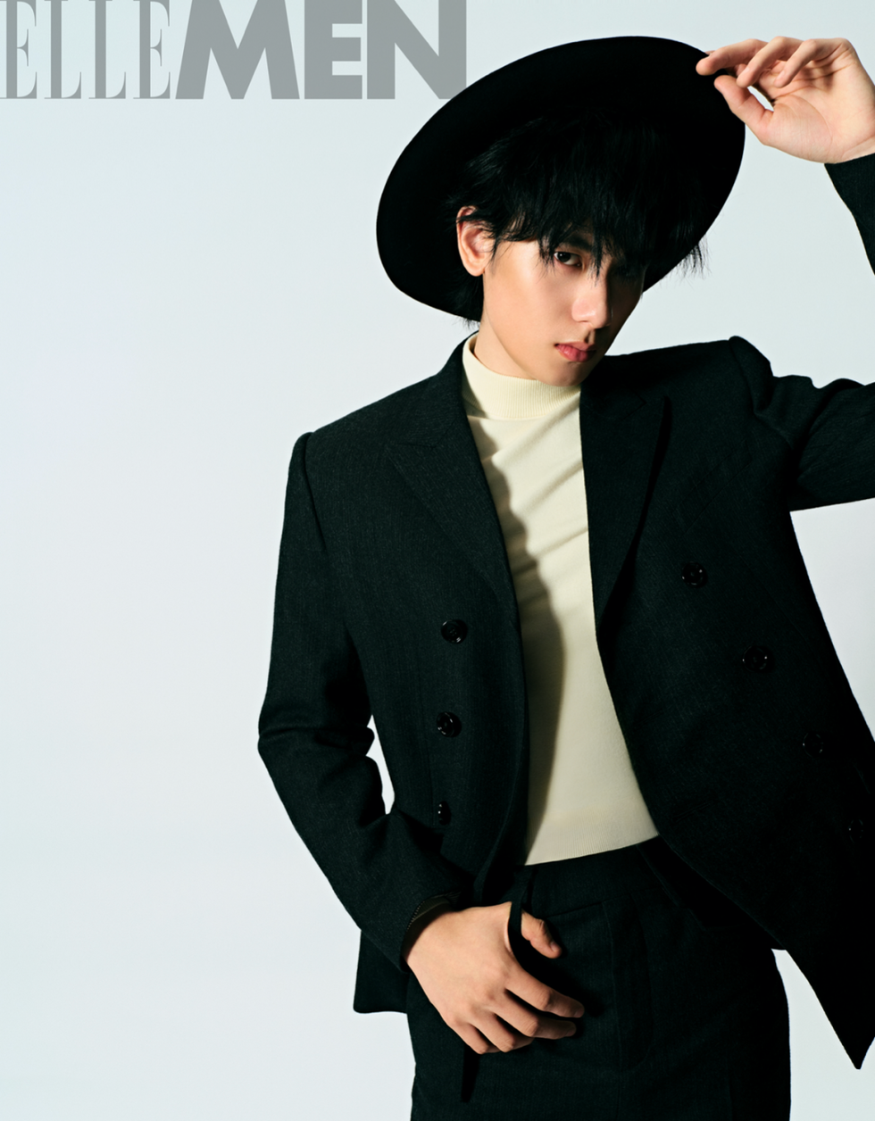 male model in a stylish outfit striking a pose