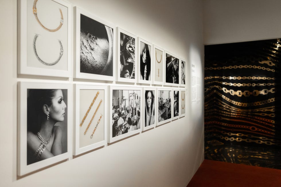 art exhibition featuring black and white photographs of jewelry and people