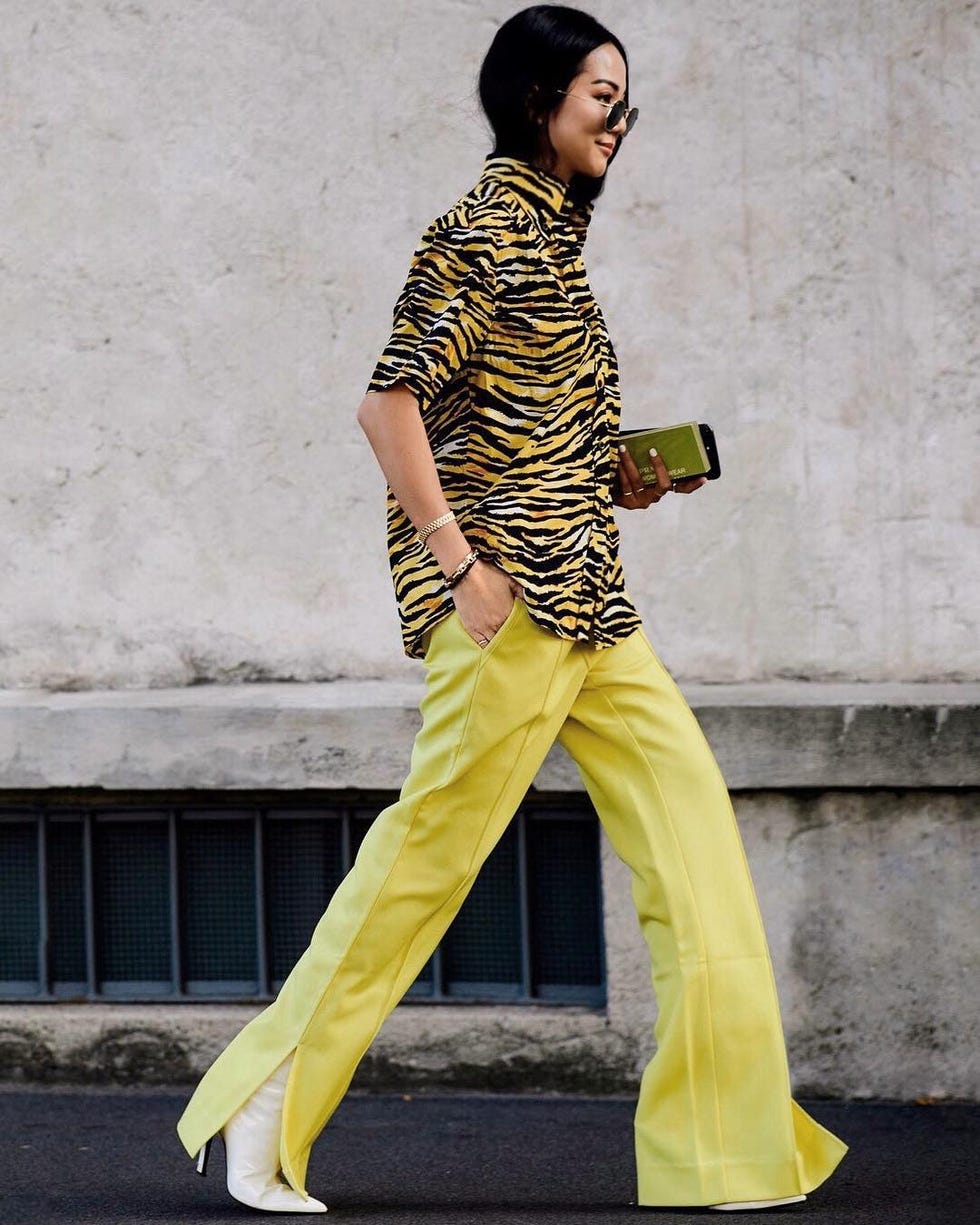 Clothing, Yellow, Street fashion, Fashion, Fashion model, Standing, Trousers, Outerwear, Leg, Photo shoot, 
