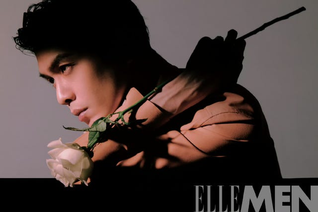 a man holding a flower