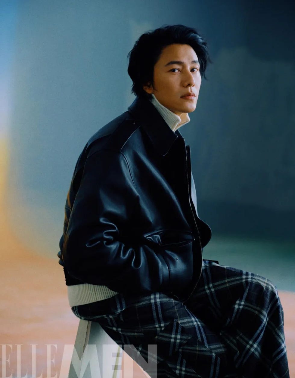 a person sitting sideways featuring a stylish outfit