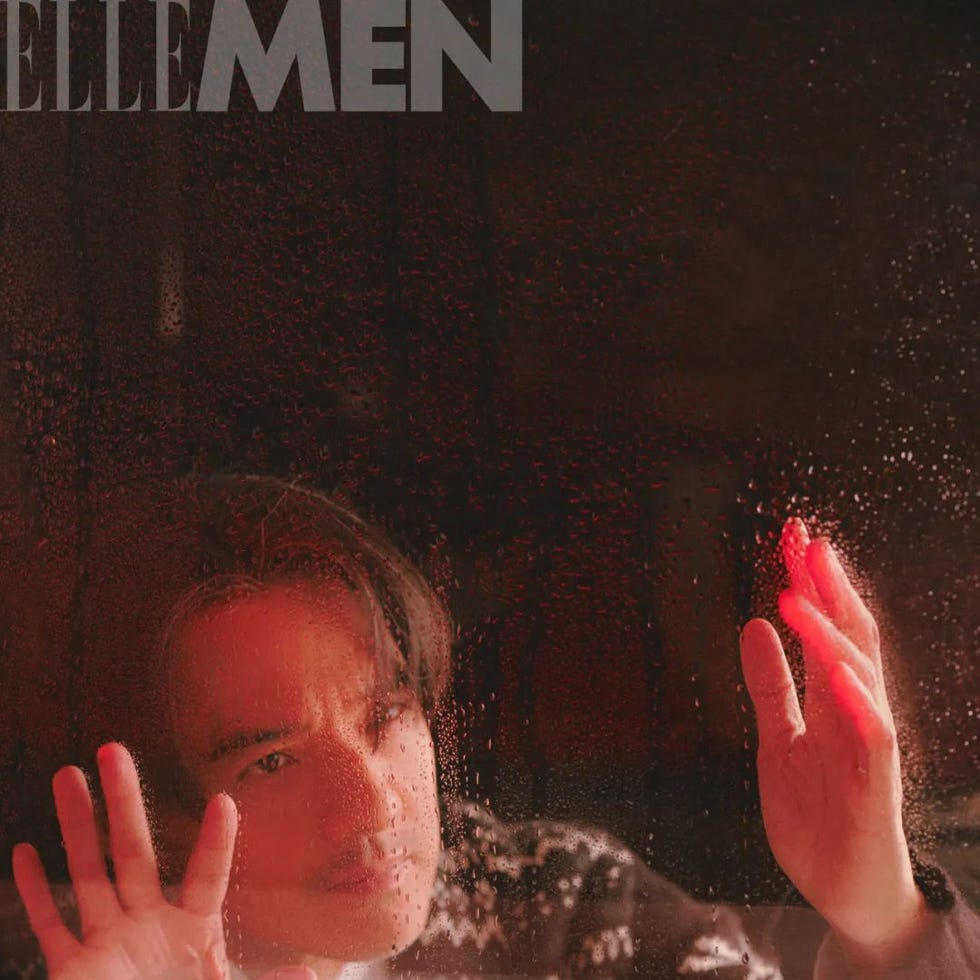 person pressing hands against a foggy glass surface