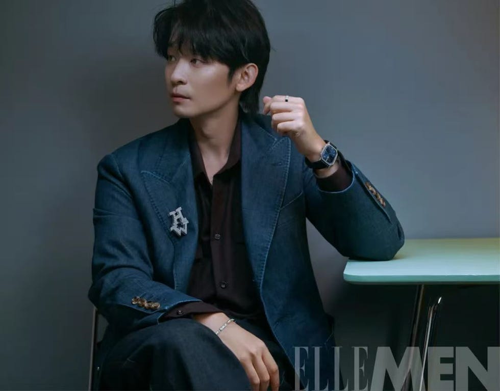 a stylish person seated showcasing a modern outfit