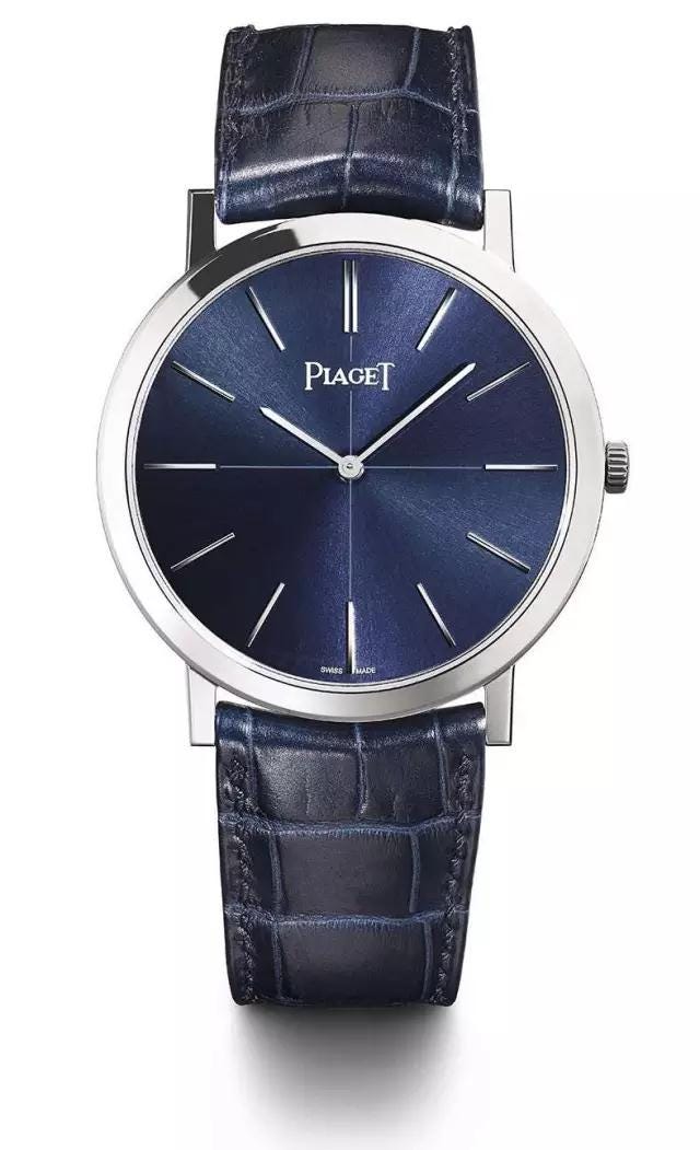 Watch, Analog watch, Watch accessory, Strap, Fashion accessory, Jewellery, Electric blue, Material property, Hardware accessory, Brand, 