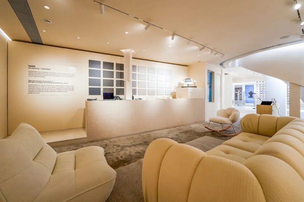 interior of a modern reception area with seating and a desk