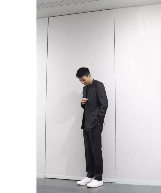Standing, Shoulder, Suit, Footwear, Neck, Door, Shoe, Formal wear, Trousers, Denim, 