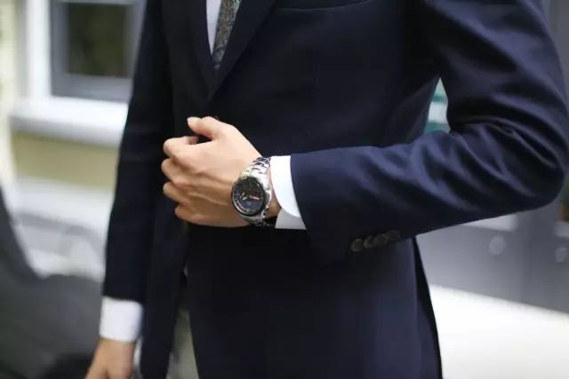 Suit, Blazer, Clothing, Formal wear, Outerwear, Tuxedo, Street fashion, Finger, Jacket, Hand, 