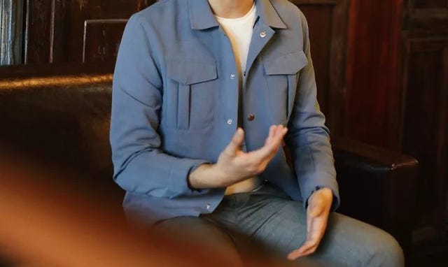 Clothing, Outerwear, Jacket, Jeans, Sitting, Sleeve, Joint, Top, Blazer, Coat, 