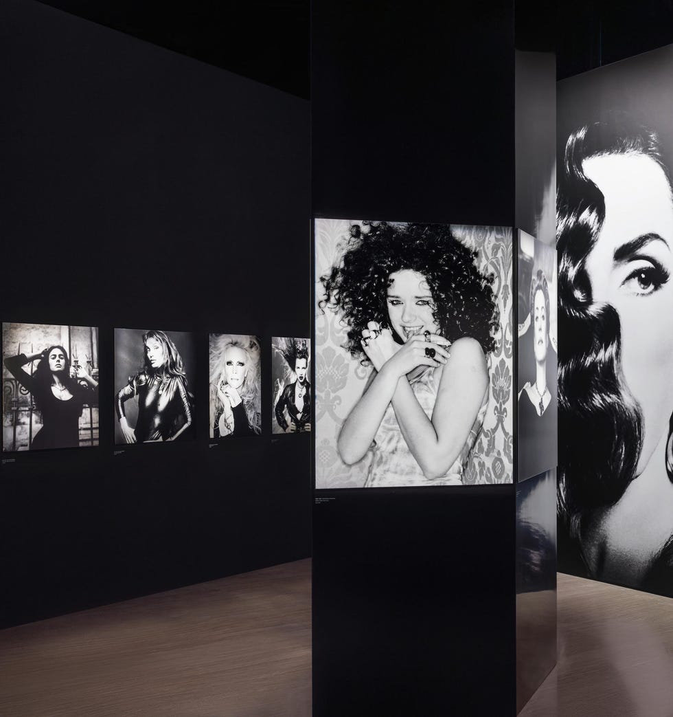gallery displaying blackandwhite photographs on dark walls