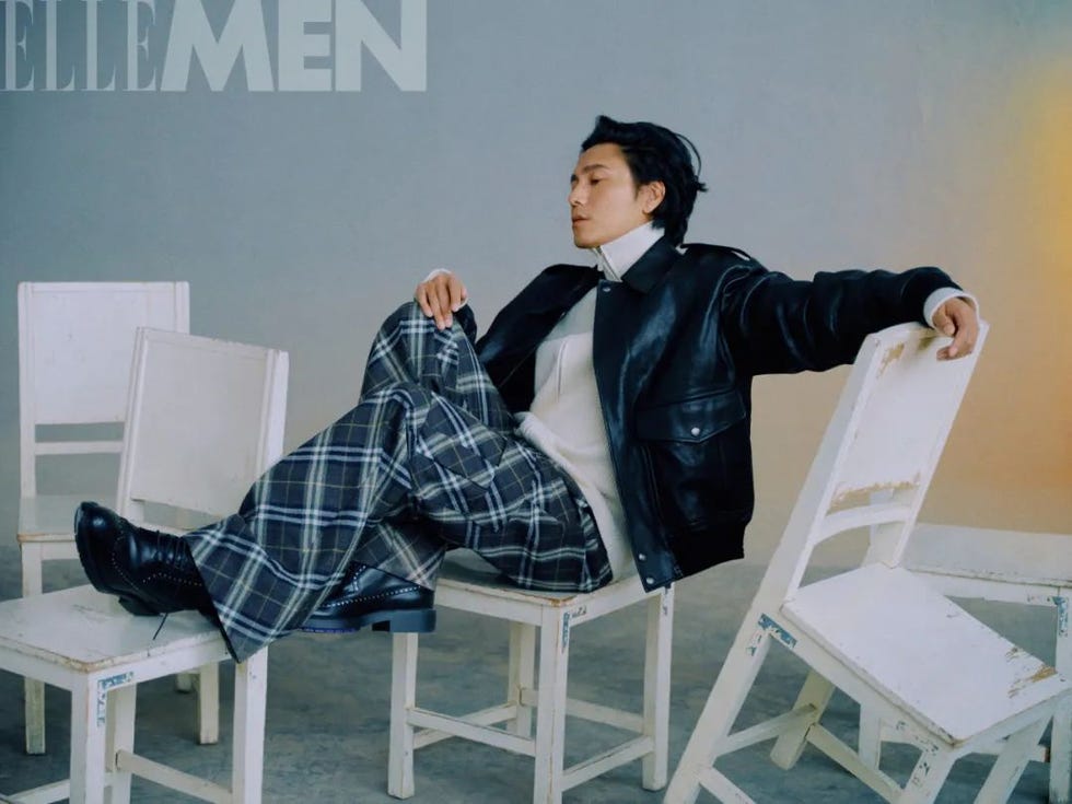 a fashionoriented shot featuring a person in a stylish outfit seated on chairs