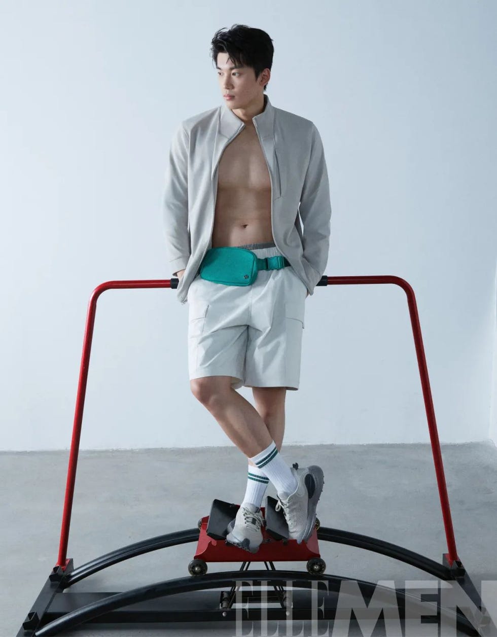 individual demonstrating a fitness exercise on a machine