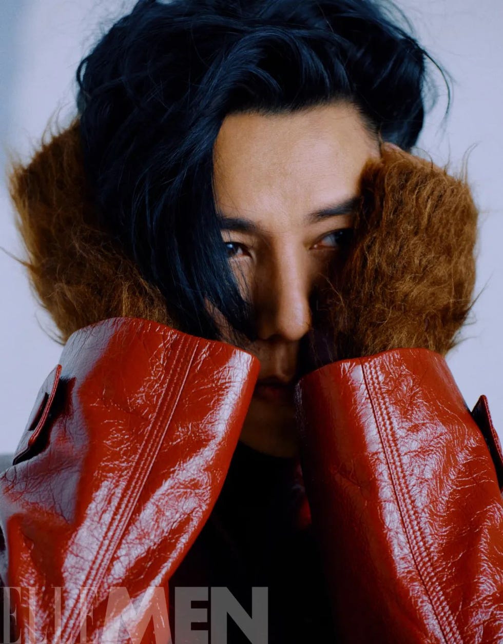 fashionable model wearing a bold red leather jacket and a textured collar