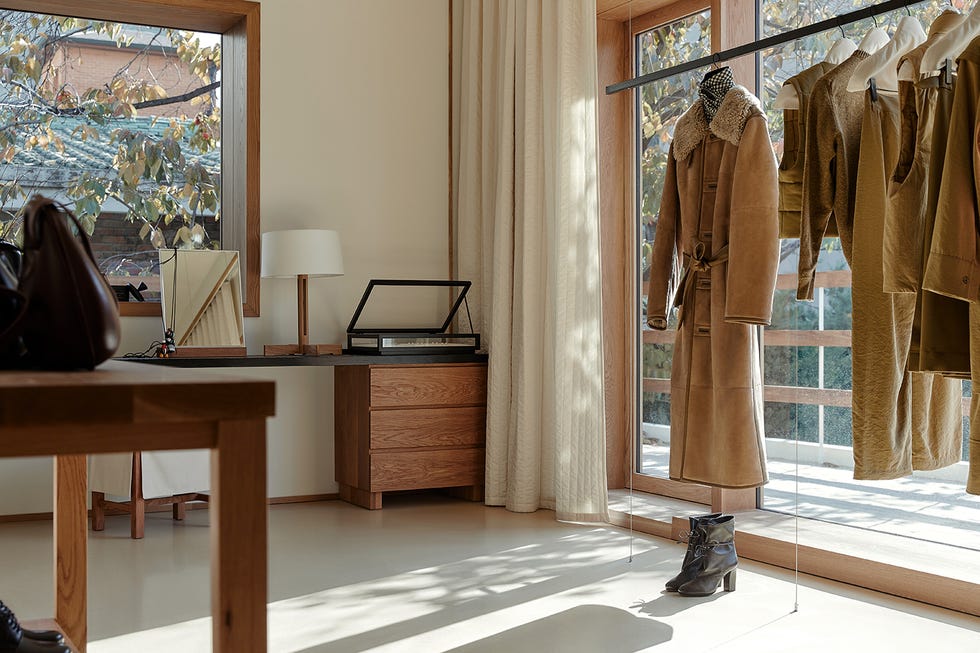 a room with a desk and a mirror
