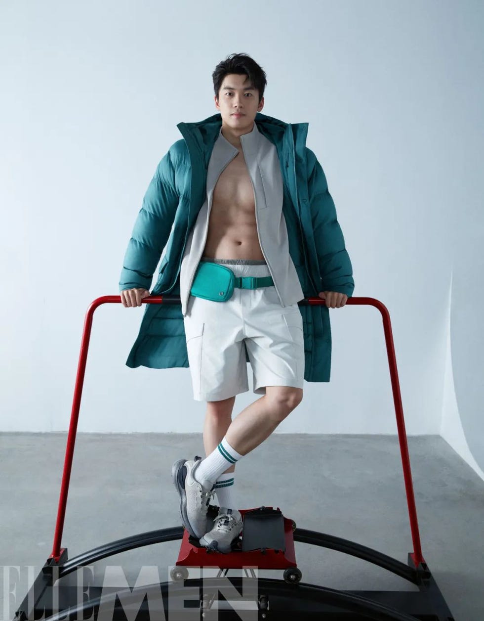 stylish male model posing with a modern trampolinelike device