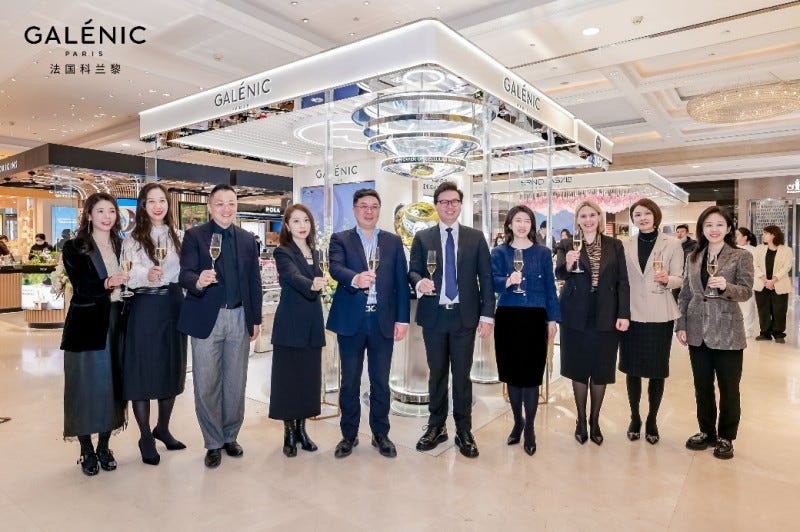 group of people celebrating in a retail environment showcasing galénic products