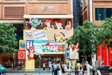 toy store entrance featuring animated characters and bright colors