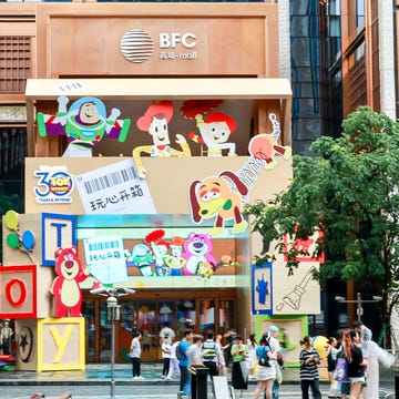 toy store entrance featuring animated characters and bright colors toy store entrance featuring animated characters and bright colors