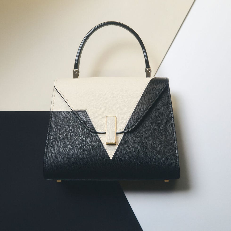stylish handbag with a geometric design in black and cream colors