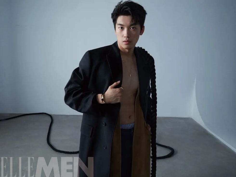 a person wearing a stylish coat showcasing a modern fashion aesthetic