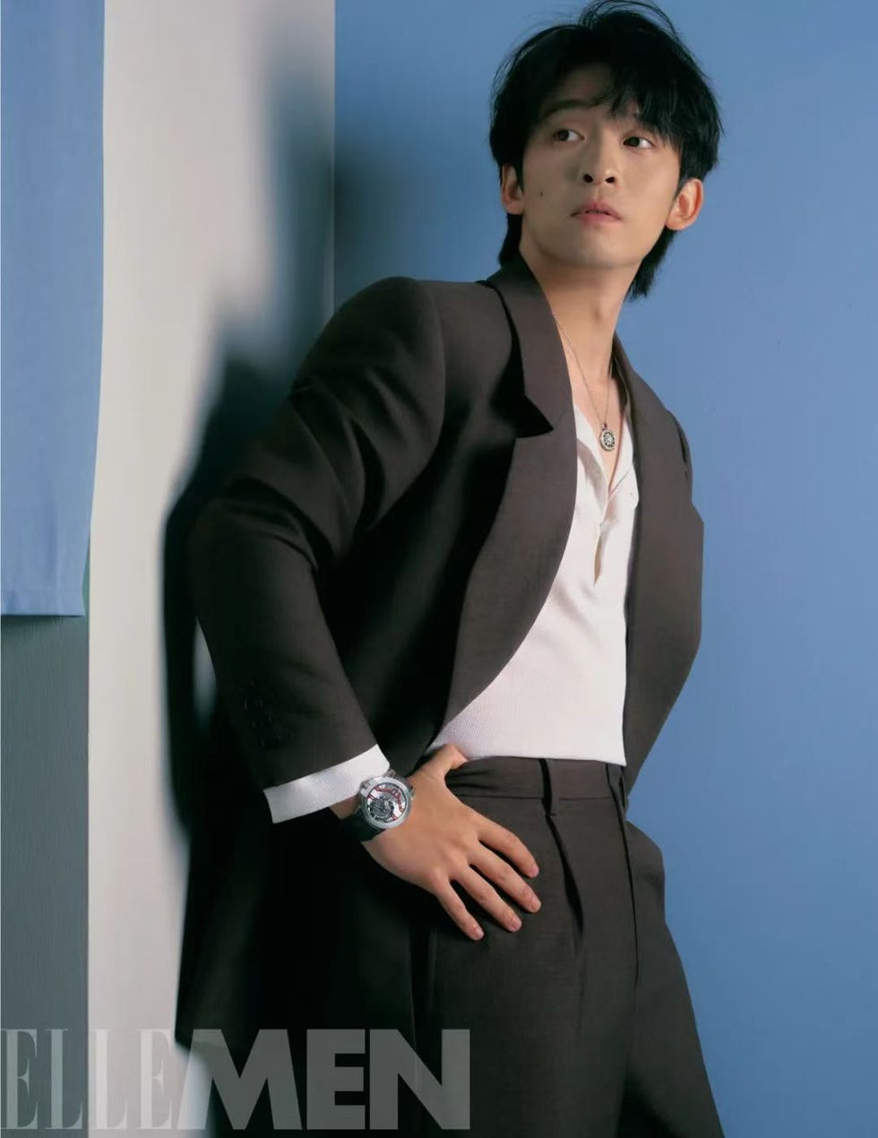 a stylish individual poses confidently showcasing modern fashion with a tailored suit