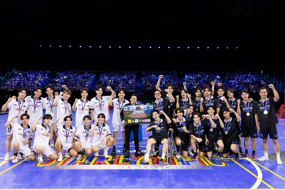 a group of men holding a trophy
