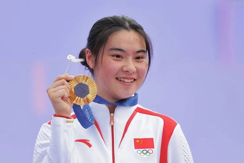 a person holding a medal