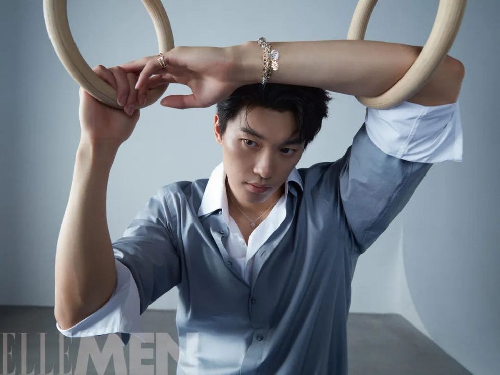 a person holds onto gym rings showcasing an exercise posture