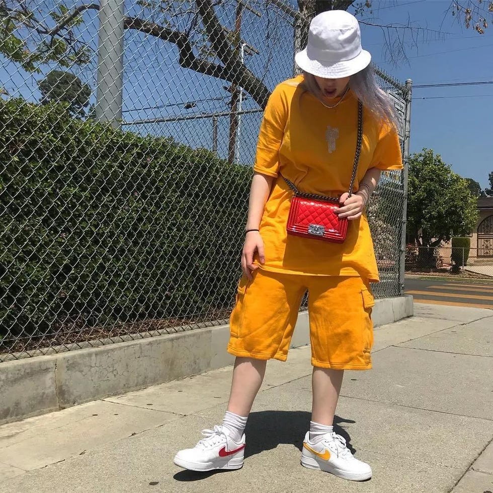 Yellow, Orange, Outerwear, Footwear, Shorts, Shoe, Street fashion, Child, Recreation, T-shirt, 