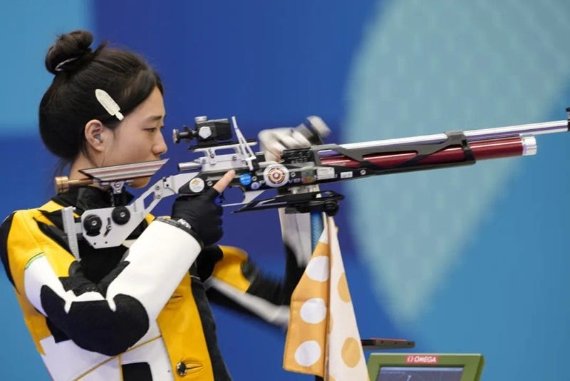 a person holding a rifle