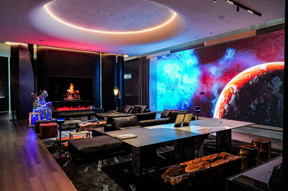futuristic living room with a galaxythemed wall and modern furniture