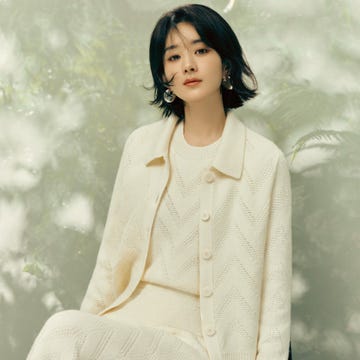 model in creamcolored textured knitwear seated in a chair model in creamcolored textured knitwear seated in a chair