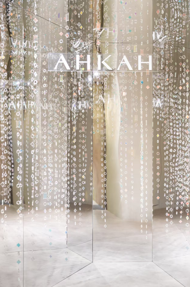 interactive installation featuring mirrored surfaces and hanging decorative elements