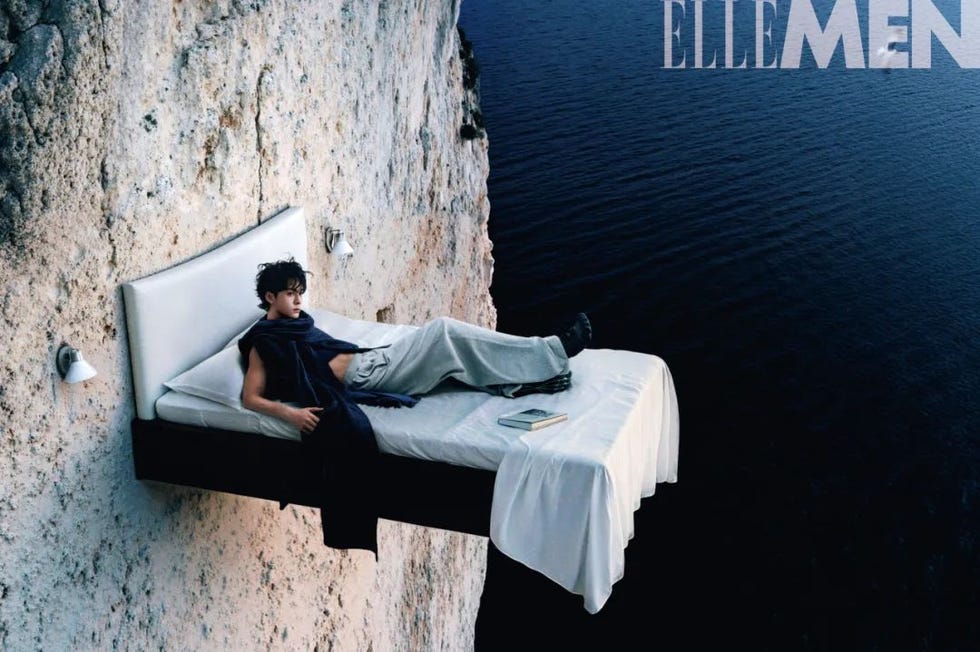 bed suspended on the edge of a cliff over water