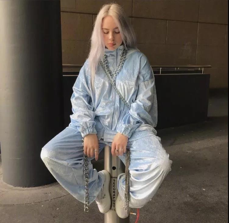 Clothing, Street fashion, Fashion, Outerwear, Jeans, Blond, Footwear, Leg, Sitting, Denim, 