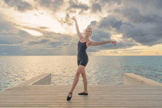 a person posing on a dock