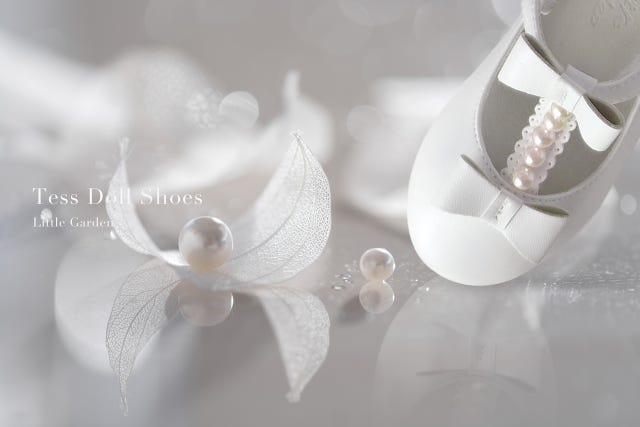 White, Footwear, Flower, Pearl, Shoe, Headpiece, Fashion accessory, Plant, Petal, Still life photography, 