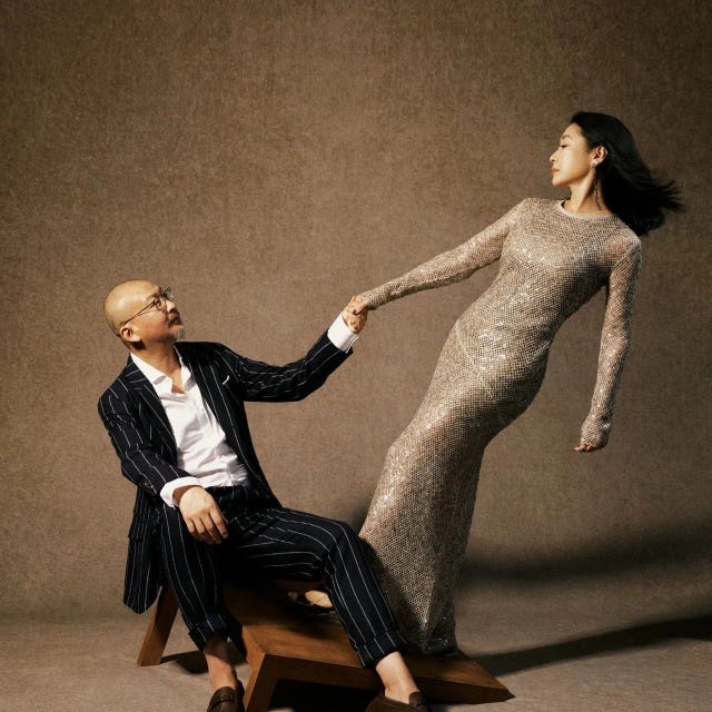 a fashion scene featuring a couple in stylish outfits showcasing a dynamic pose