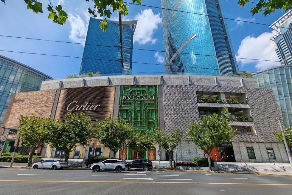 luxury retail store front displaying cartier and bvlgari brands